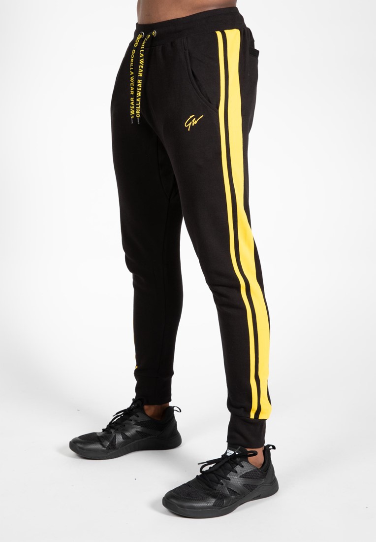 black and yellow nike joggers